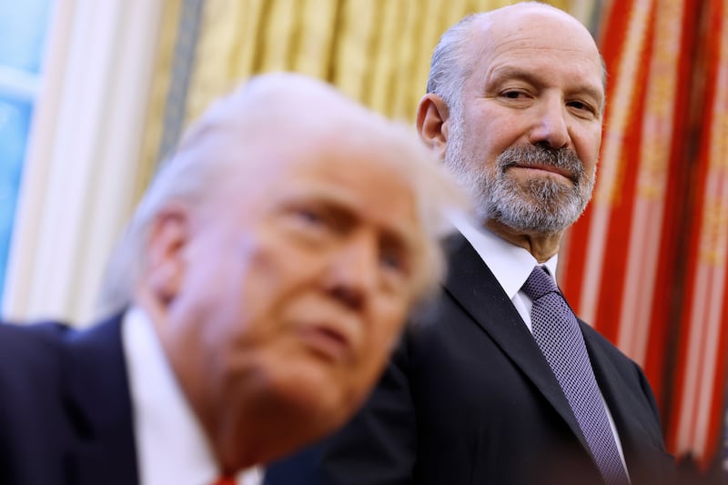 U.S. President Donald Trump, alongside Howard Lutnick