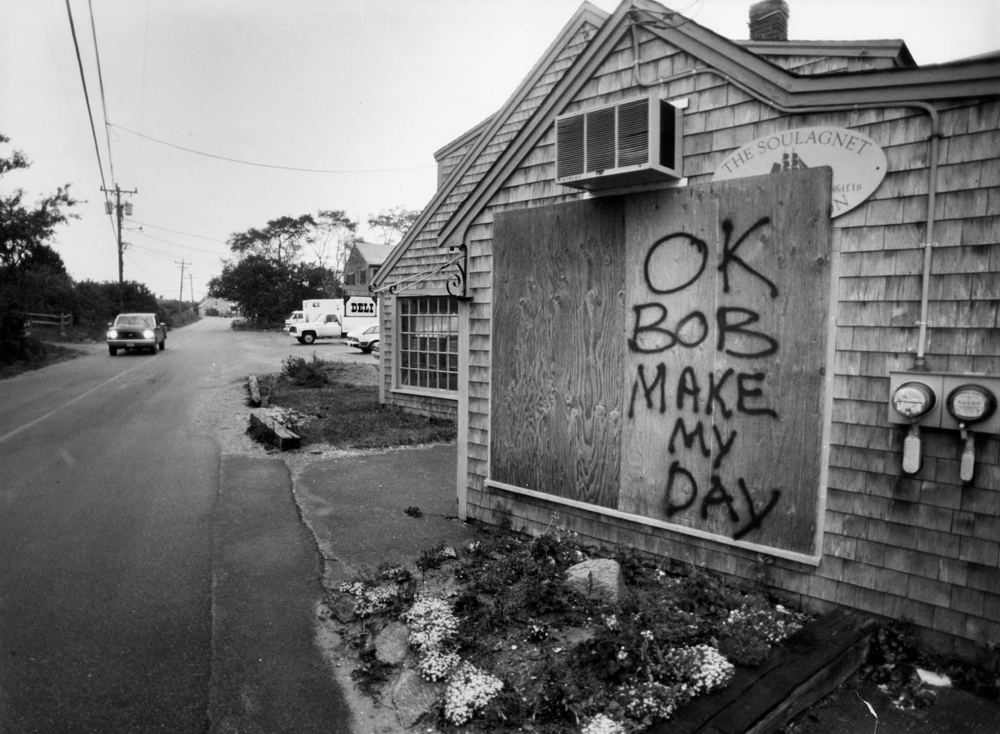 A board put up to protect a deli in Menemsha, Mass., on Martha's Vineyard, carried a challenge to the elements on Aug. 20, 1991, ahead of Hurricane Bob.