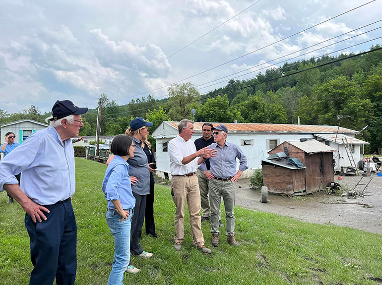 Photo: Governor Scott discusses the impact of flooding in Barre, with (from left) Senator Sanders, Congresswoman Balint and former FEMA Director Criswell on  July 12, 2023. Courtesy photo.