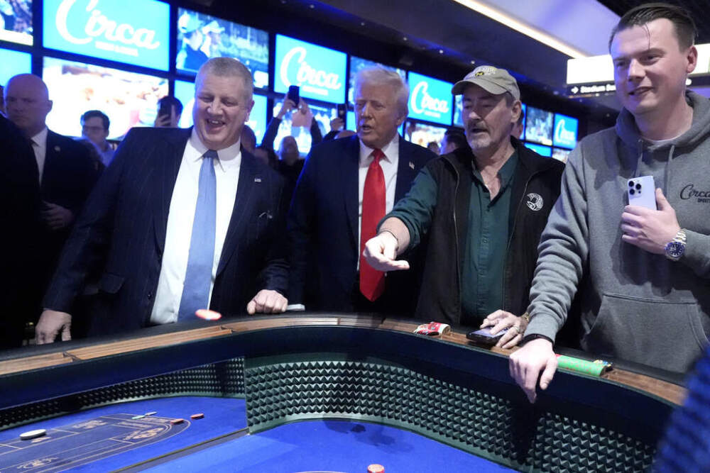 President Donald Trump, second from left, stands at a craps table after speaking about the economy at the Circa Resort and Casino in Las Vegas, Saturday, Jan. 25, 2025. (AP Photo/Mark Schiefelbein)