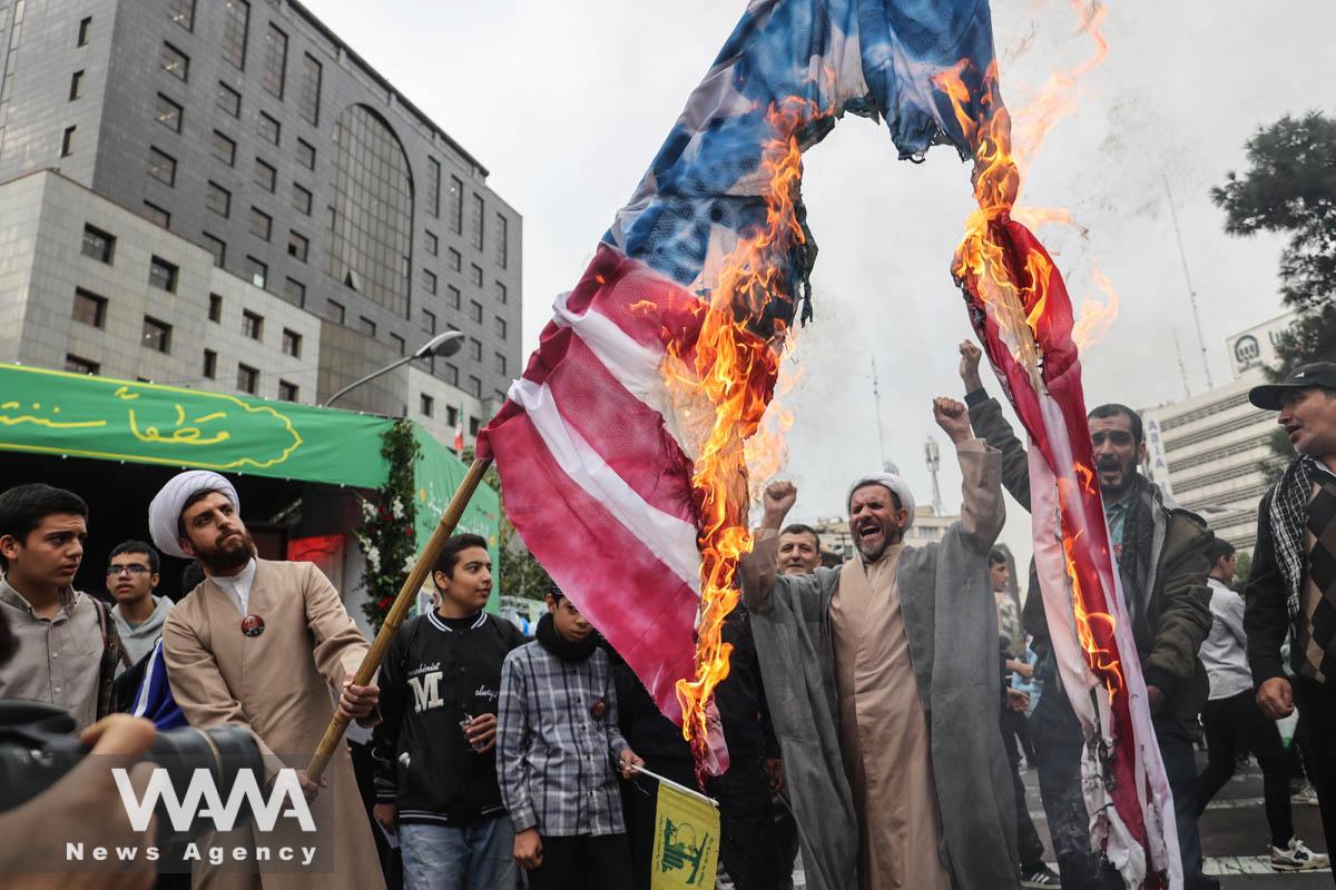 Iranians burn a U.S. flag during the 45th anniversary of the U.S. expulsion from Iran