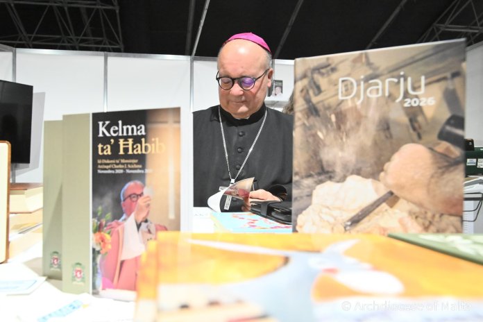 Archbishop Charles Scicluna signs book at Malta Book Festival
