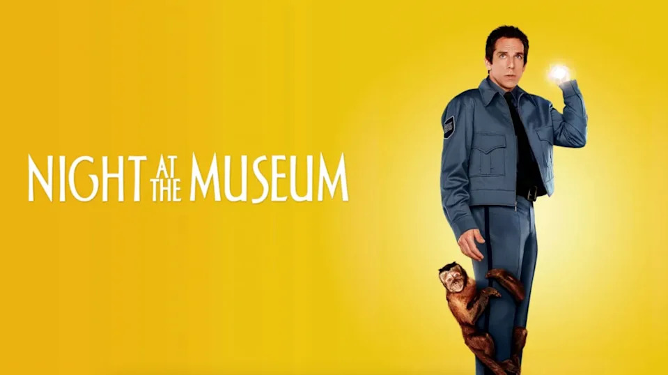 Man in a security uniform stands with a monkey on his leg, holding a glowing object, on a yellow background with "Night at the Museum" text