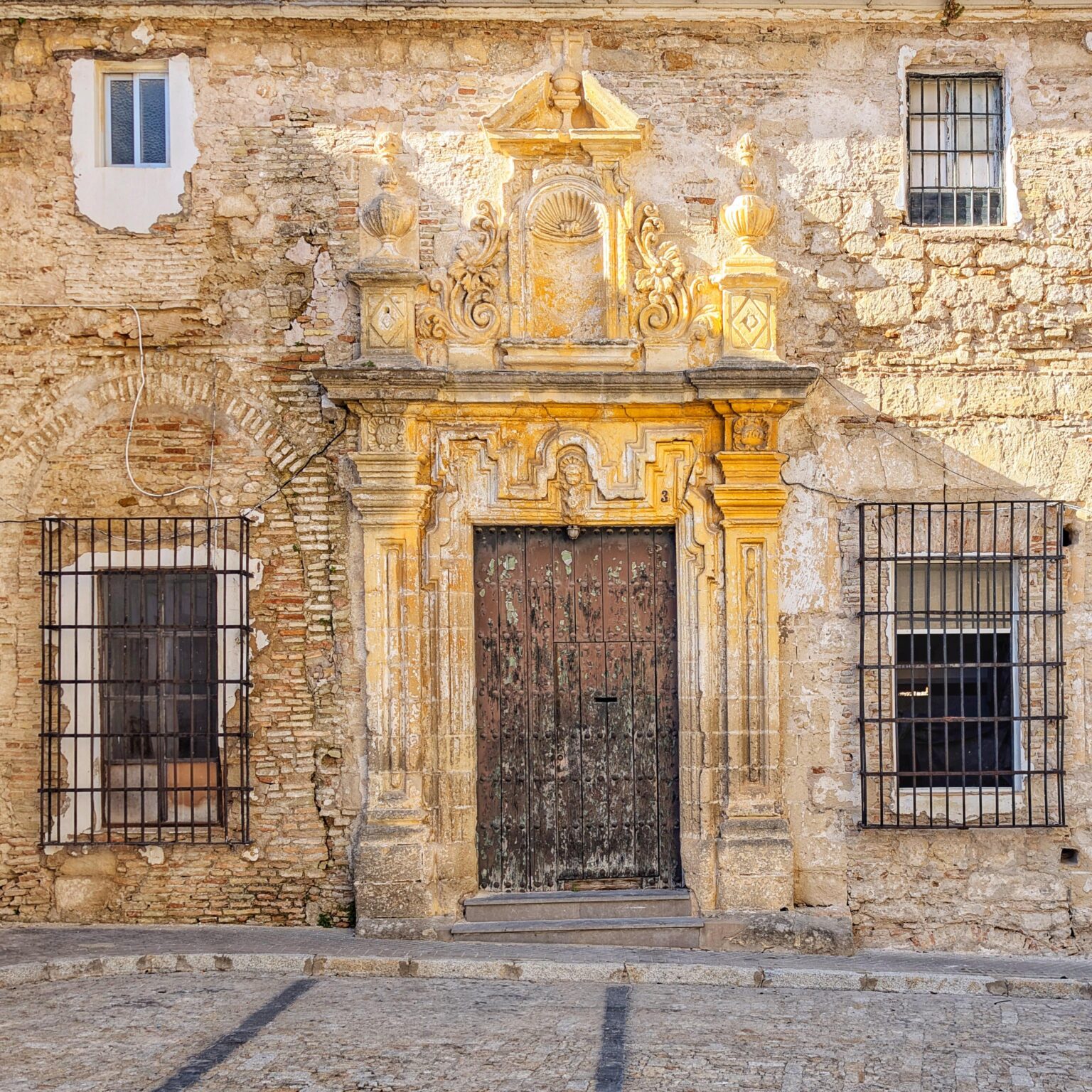 Historic, weather-worn door in Jerez de la Frontera