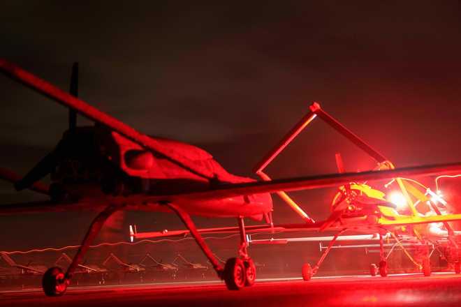 Long-range drones An-196 Liutyi of the Ukrainian 14th Separate Unmanned Aerial Systems Regiment stand in line before takeoff in undisclosed location, Ukraine, Tuesday, Oct. 14, 2025. (AP Photo/Evgeniy Maloletka)