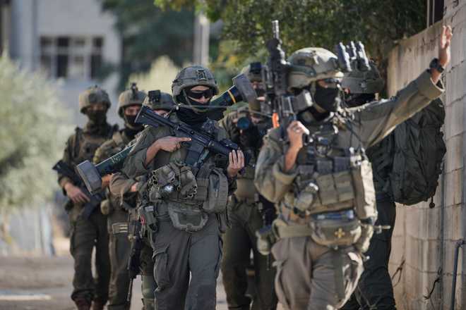 Israeli soldiers are seen during an army raid in the West Bank town of Tubas, Wednesday, Nov. 26, 2025. (AP Photo/Majdi Mohammed)