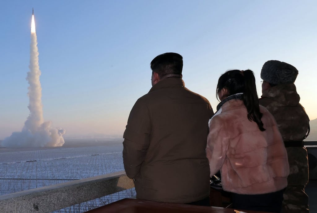 Kim Jong-un (left) and his daughter, Ju-ae (centre), watch a test of a nuclear-capable Hwasong-18 intercontinental ballistic missile on December 18, 2023. Photo: KCNA/dpa