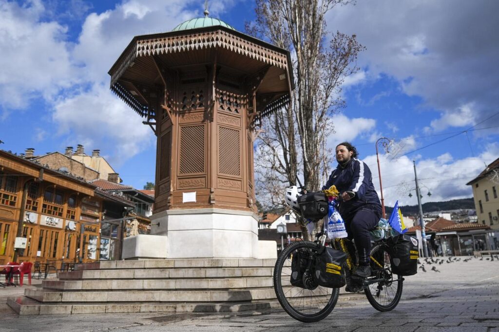 Burak Ozturk, a 26-year-old Turkish young man who set off on a bicycle from Germany to fulfill his pilgrimage, is welcomed in Sarajevo, Bosnia and Herzegovina on March 13, 2025. (AA Photo)
