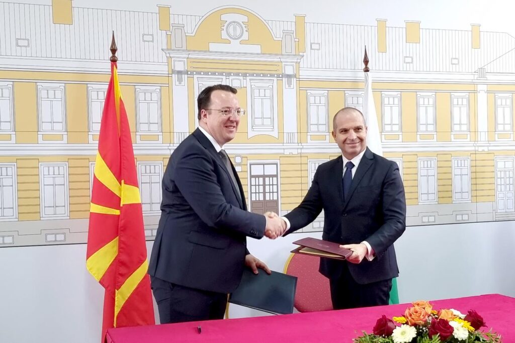 Bulgarian Deputy PM and Minister of Transport and Communications Grozdan Karadzhov (R) and North Macedonian Deputy PM and Minister of Transport Aleksandar Nikolovski (L) sign an agreement covering cooperation between Bulgaria and North Macedonia on the preparation, construction, and operation of a joint railway tunnel, Sofia, Bulgaria on Nov. 6, 2025. (AA Photo)