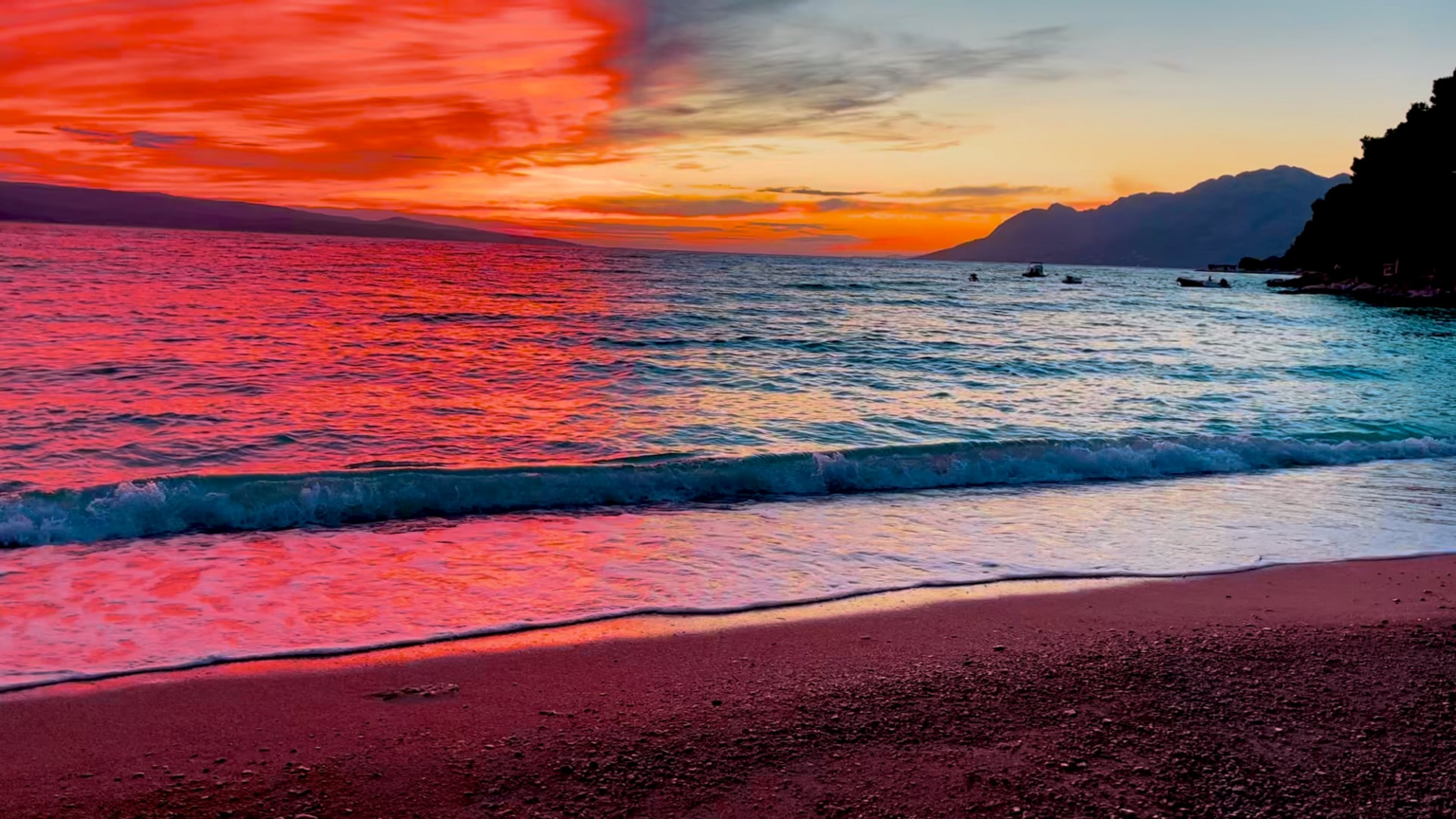 I filmed this sunset in Brela a few years ago. Half the sky turned red and the other half blue.