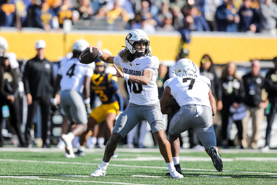 Nov 8, 2025; Morgantown, West Virginia, USA; Colorado Buffaloes quarterback Julian Lewis (10) throws a pass during the first quarter against the West Virginia Mountaineers at Milan Puskar Stadium. Mandatory Credit: Ben Queen-Imagn Images