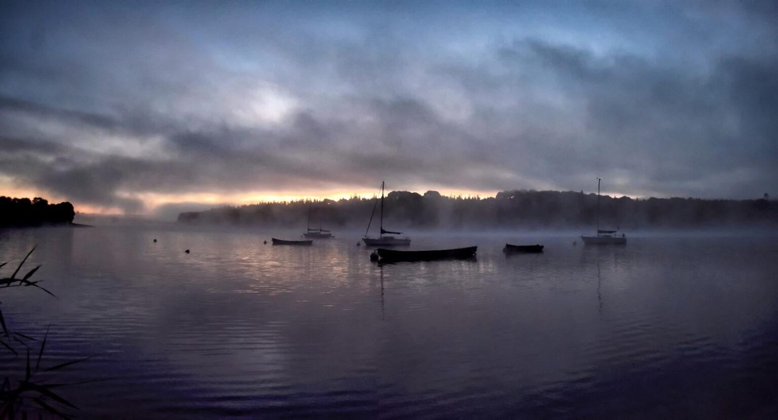 Boats at sunrise at the lakes. Wicklow, Ireland