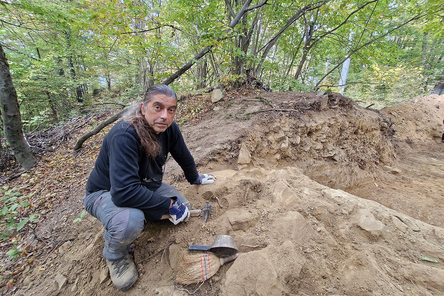 Excavation exposes the three-layer construction of the prehistoric ramparts