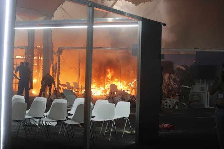 Rows of chairs with an area behding on fire