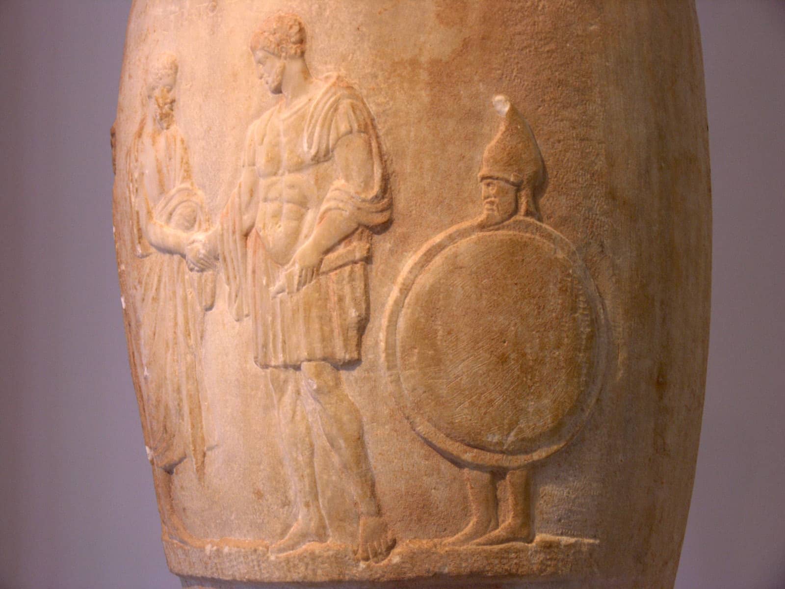 Funerary loutrophoros; on the right, a bearded slave carries his master's shield and helm