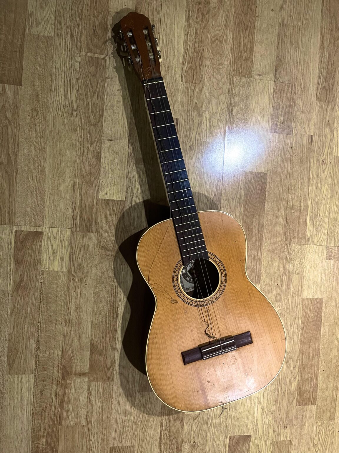 Old guitar from understress; how much would it cost to change the strings?
