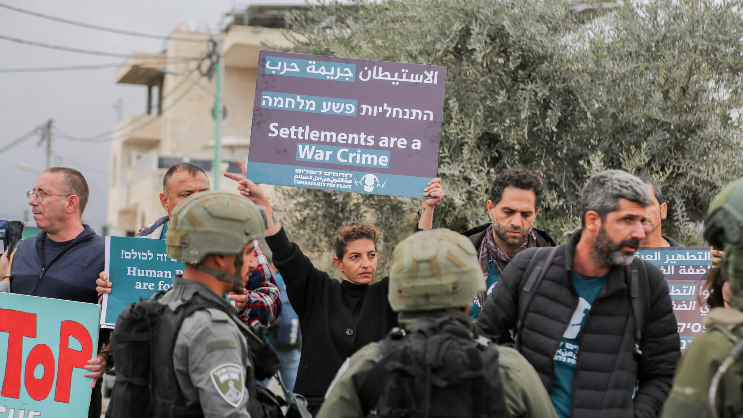 Israeli and Palestinian activists argue with members of Israel's security forces during a protest against Israeli settler violence at the north entrance of Beit Jala, near Bethlehem in the occupied West Bank on Nov. 14.