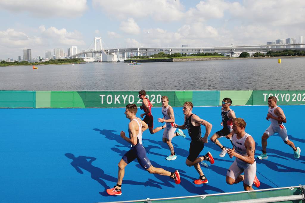 TOKYO, JAPAN - JULY 26: Kevin McDowell of Team United States, Max Studer of Team Switzerland, Casper Stornes of Team Norway, Tayler Reid of Team New Zealand, Alex Yee of Team Great Britain, Kristian Blummenfelt of Team Norway and Gustav Iden of Team Norway run during the Men's Individual Triathlon on day three of the Tokyo 2020 Olympic Games at Odaiba Marine Park on July 26, 2021 in Tokyo, Japan