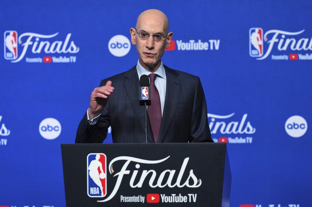 NBA Commissioner Adam Silver speaking at a press conference with "Finals Presented by YouTube TV" branding.