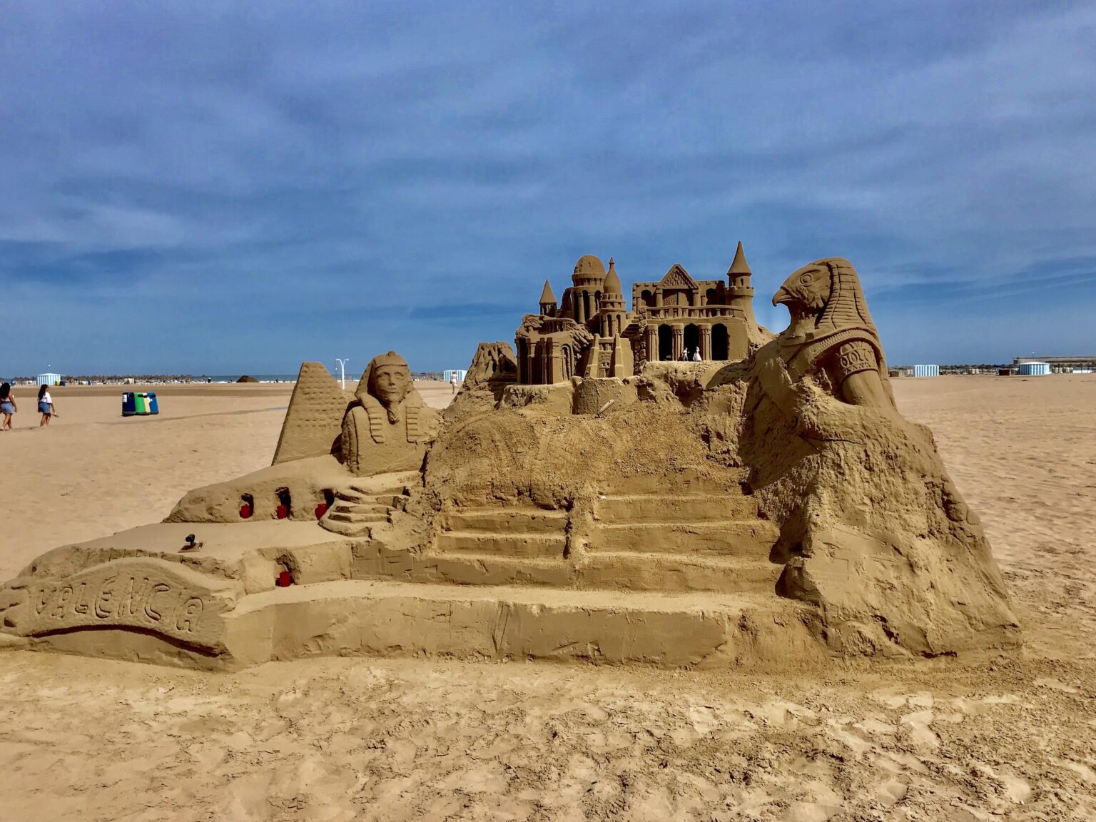 Sand sculpture on Valencia beach. I took this photo during my vacation there. I was impressed to see how much dedication, patience and talent it takes to create such a detailed and ephemeral work. Every grain of sand seems to be part of a dream that will soon disappear with the wind or the sea.