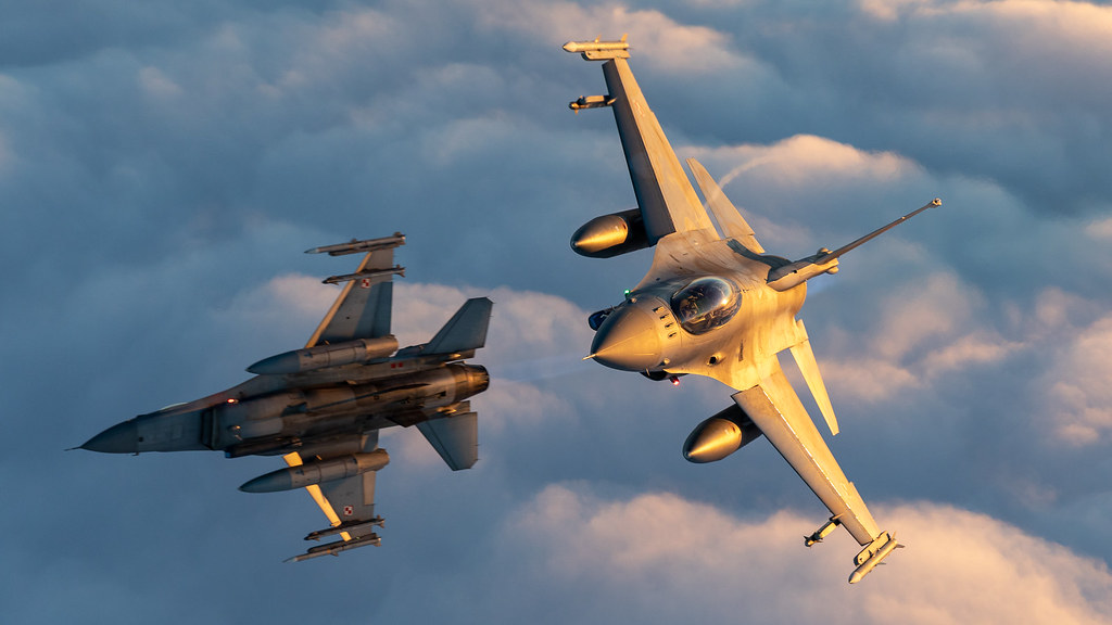 Two Polish AIr Force F-16s conducting training manoeuvres in the skies over Lithuania during their N...