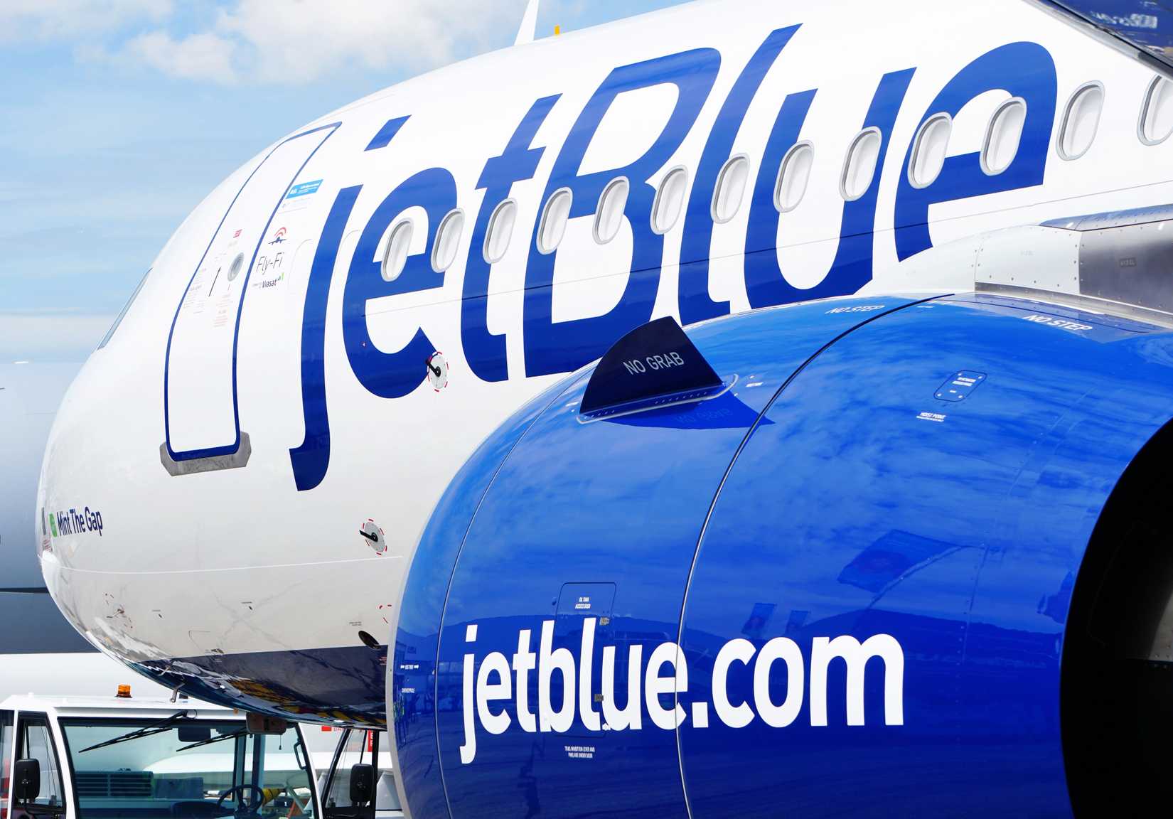 A JetBlue A321LR is towed into its parking position for display at the 2023 Paris Airshow