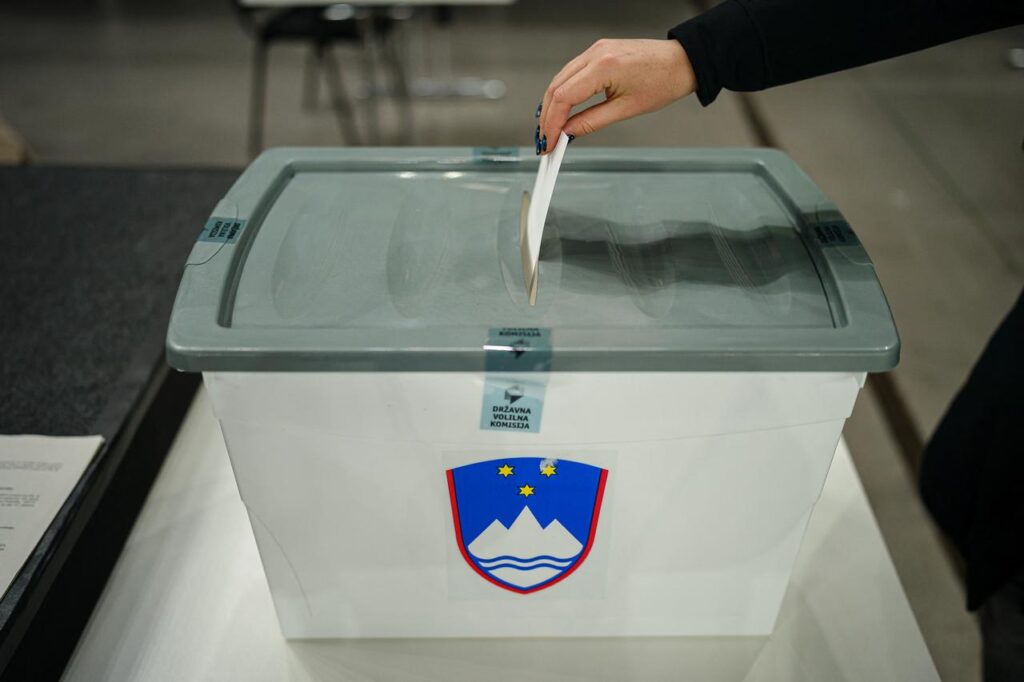 A voter places a ballot into the box at a polling station during the referendum on whether to implement or suspend the assisted-dying law. Ljubljana, Slovenia, November 23, 2025. (AFP Photo)