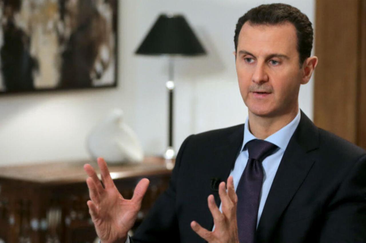 Ousted Syrian President Bashar al-Assad gestures during an exclusive interview with AFP in the capital Damascus, Feb. 11, 2016. (AFP Photo)
