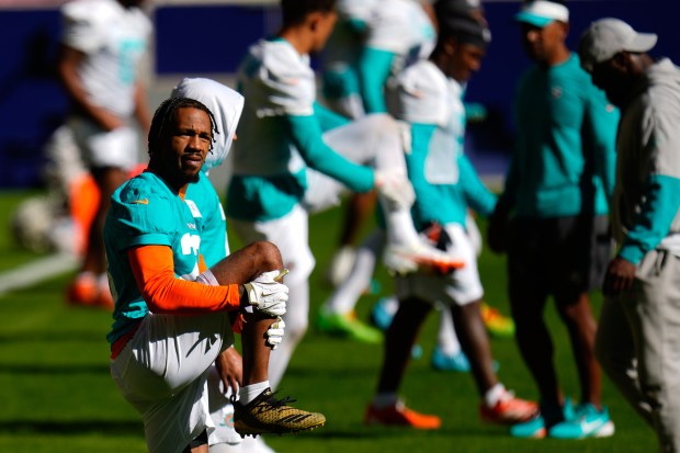 CORRECTS ID Miami Dolphins Jack Jones warms up during a training session in Madrid, Spain, Wednesday, Nov. 12, 2025, ahead of Sunday's NFL football game against Washington Commanders. (AP Photo/Manu Fernandez)