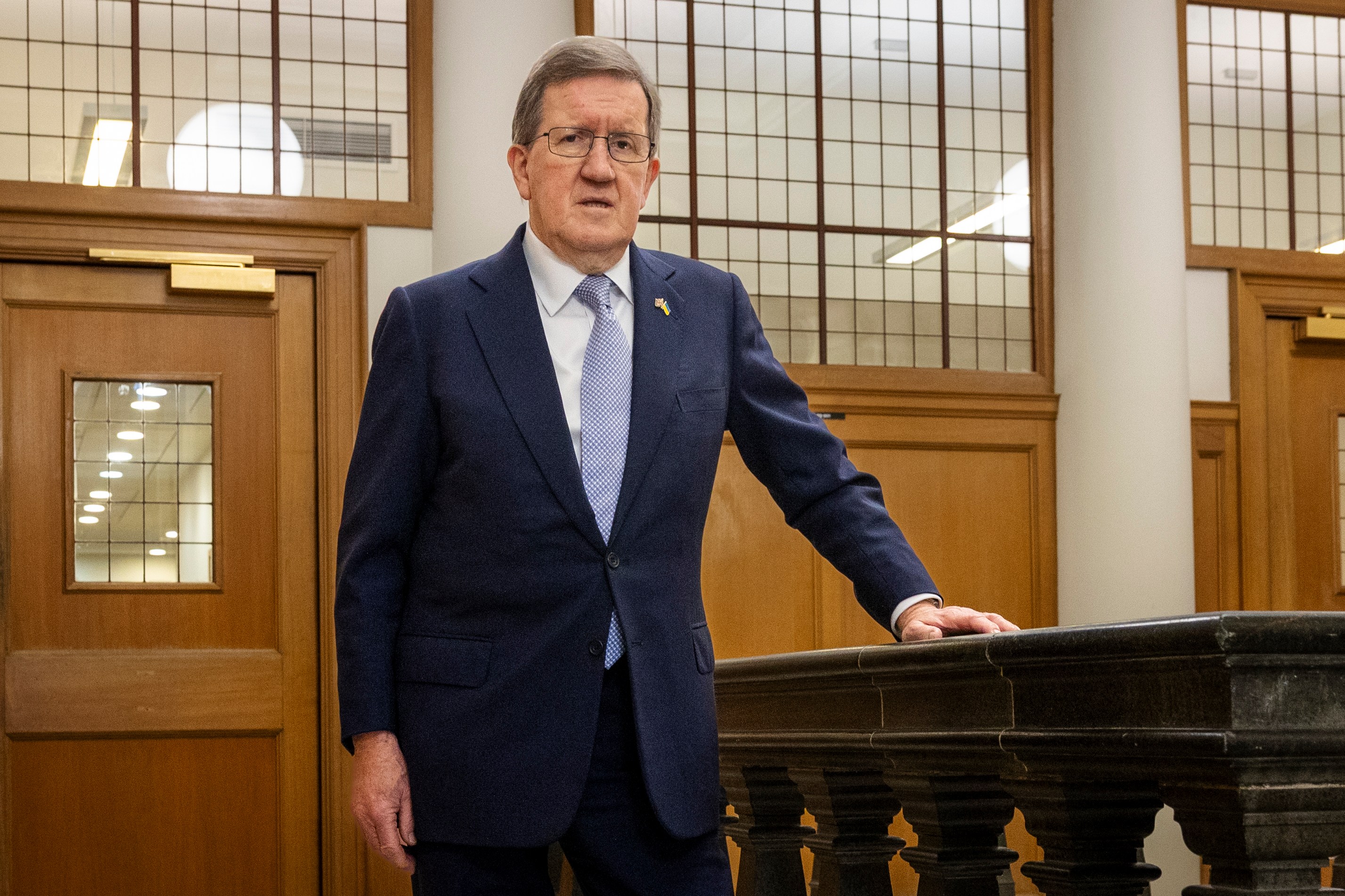 Lord George Robertson, former chief of NATO, stands in his office in Westminster before his interview.