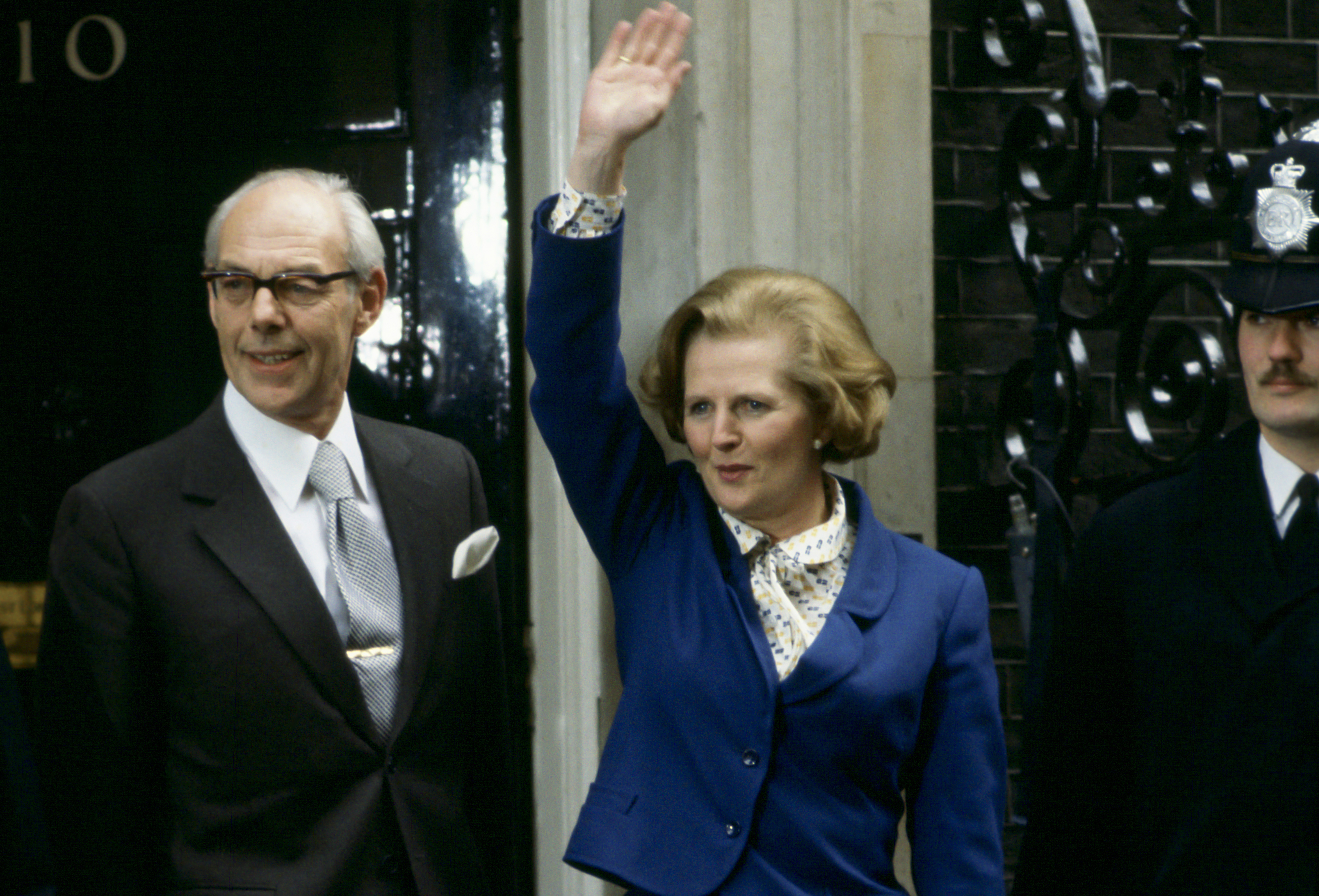 Prime Minister Margaret Thatcher, with husband Denis Thatcher, waves to well-wishers outside Number 10 Downing Street.