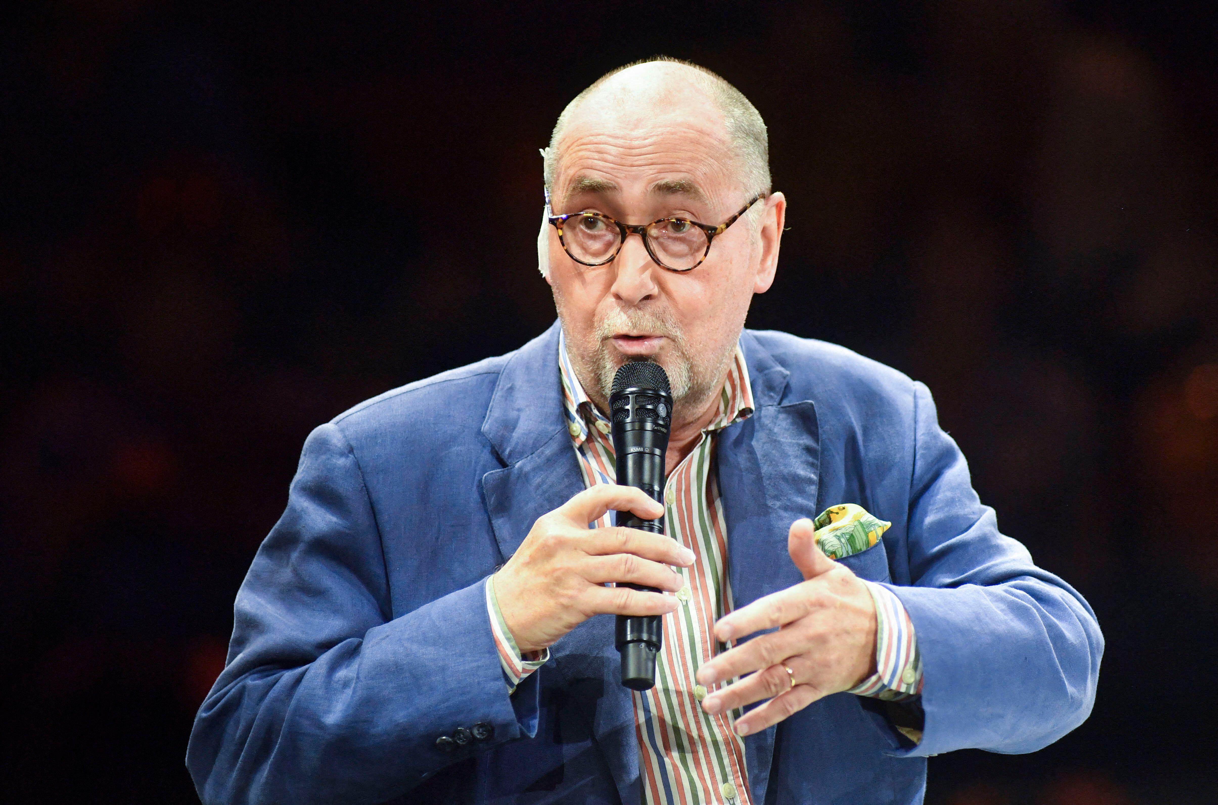 Former French ambassador to Algeria, Xavier Driencourt, speaking into a microphone.