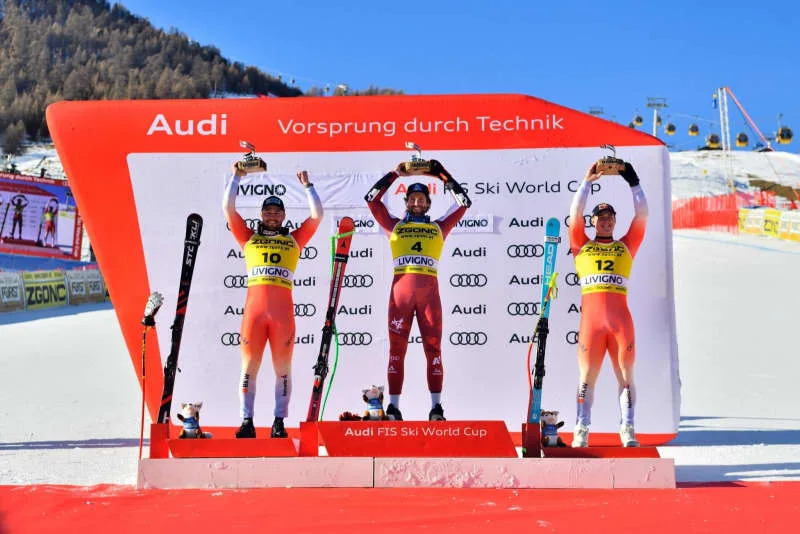 (L-R) Switzerland's second placed Alexis Monney, Austria's winner Marco Schwarz and Switzerland's third placed Franjo von Allmen celebrate on the podium after the Men's SuperG, Alpine Ski race of the 2026 Audi FIS Ski World Cup in Livigno. Davide Vaninetti/LiveMedia-IPA/ZUMA Press Wire/dpa