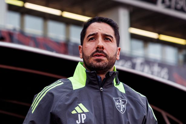 Joao Pereira watches on from the dugout.