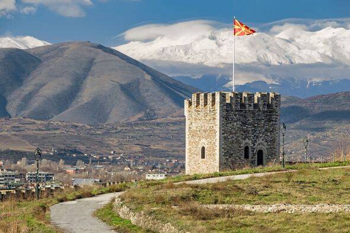 Timeless Tower of Skopje Fortress Beneath Snowy Peaks