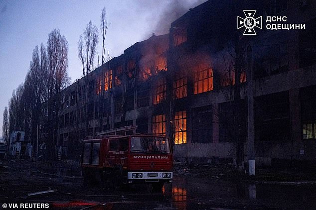 Firefighters work at the site of a Russian missile and drone strike, amid Russia's attack on Ukraine, in Odesa region, Ukraine in this handout picture released December 13, 2025