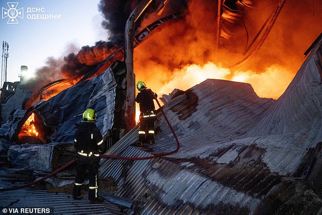 Firefighters work at the site of a warehouse of home appliances which was hit during an overnight Russian drone strike, amid Russia's attack on Ukraine, in Odesa, Ukraine December 16, 2025