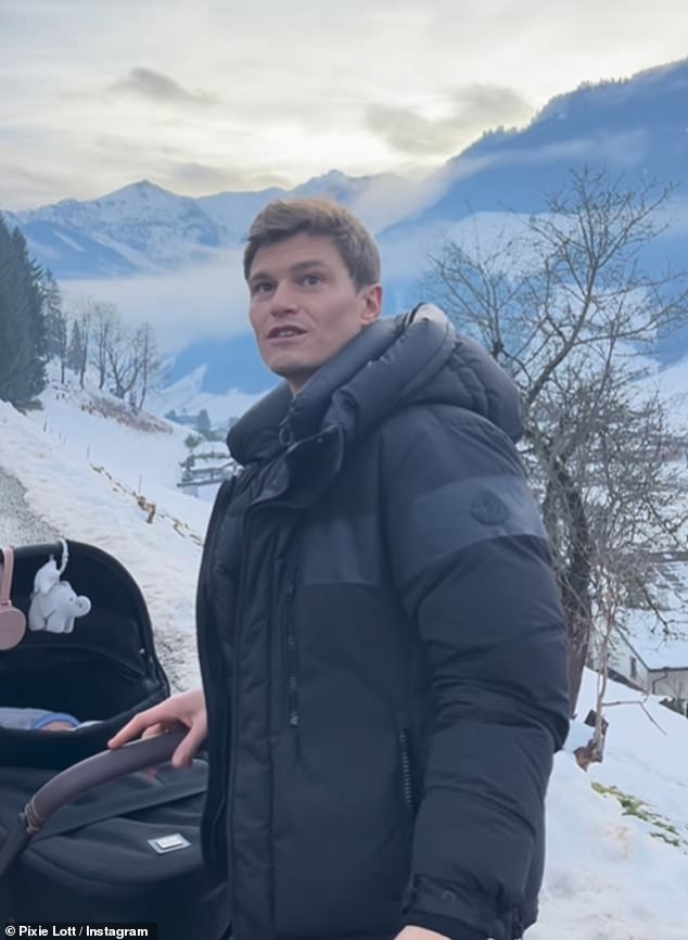 The singer, 34, who welcomed her second child with her model husband Oliver (Pictured) in October, has dedicated her new hit Christmas song, First Christmas, to her baby son