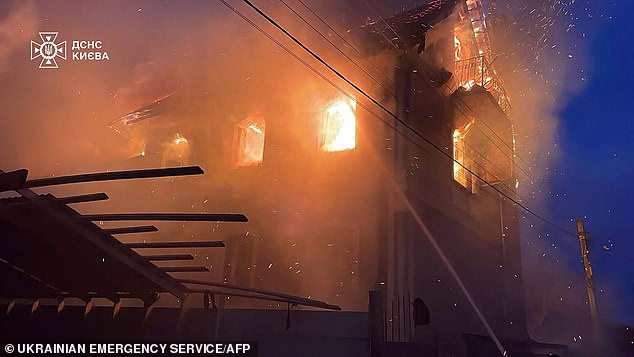 In Vyshgorod, in the wider Kyiv region, rescuers pulled a man from the ruins of a house destroyed in a Russian strike. Pictured: A building damaged during a Russian drone and missile attack in Kyiv