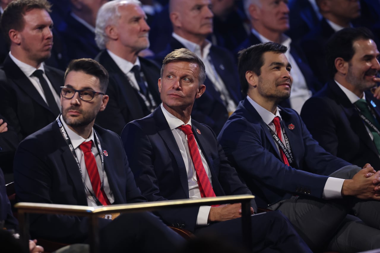 A crowd watches a presentation.