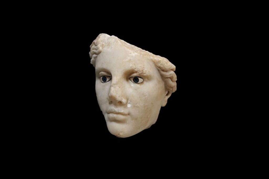 The marble head of a Hellenistic-era goddess from Metropolis is shown after cleaning, revealing detailed facial features in an ancient commercial district near Izmir, western Türkiye, Dec. 11, 2025. (AA Photo)