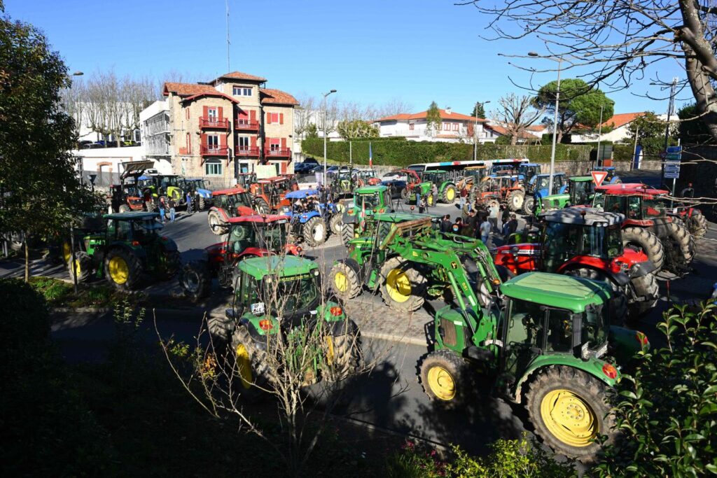 French farmers spray manure and continue road blocks over cow disease cull