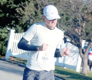 Left: Local finisher Dylan Forrester of Massapequa Park