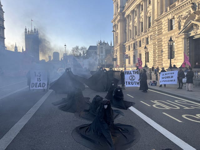 Some of the protesters dressed in long black robes