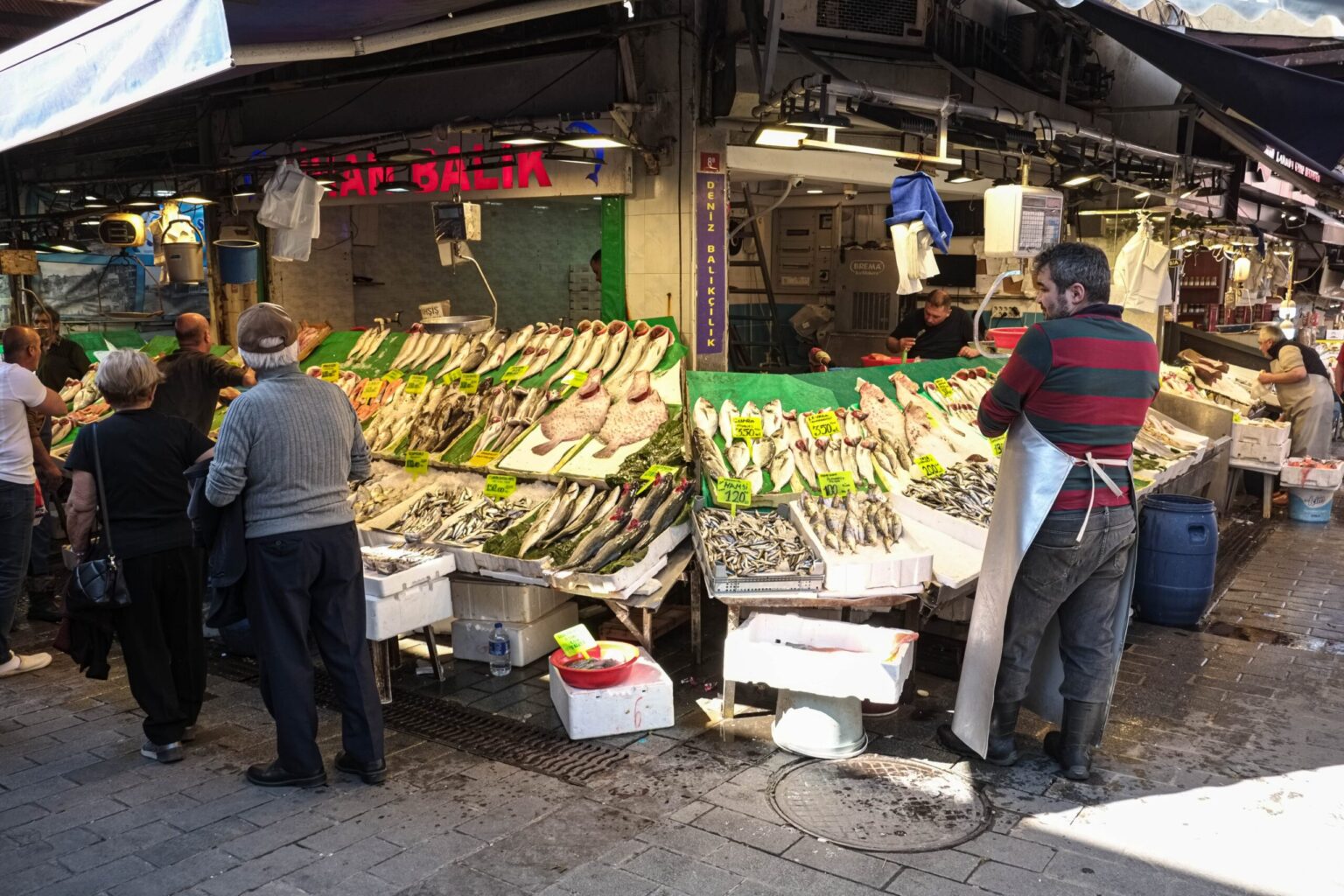 Turkey raises minimum wage by a quarter A worker at a seafood stall in an Istanbul farmers market