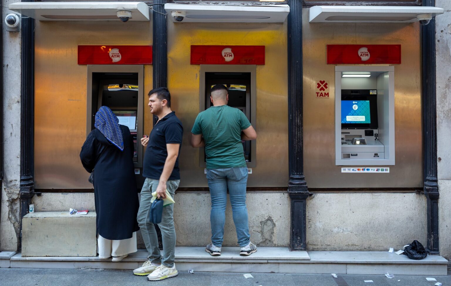 People using ATMs in Istanbul. The contraction in Turkey's agricultural sector is likely to result in higher prices in the shops