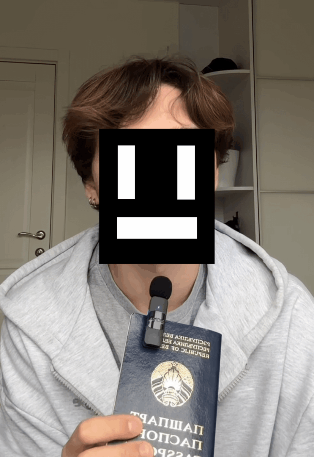 Is it normal or recommended to use your passport as a microphone holder?