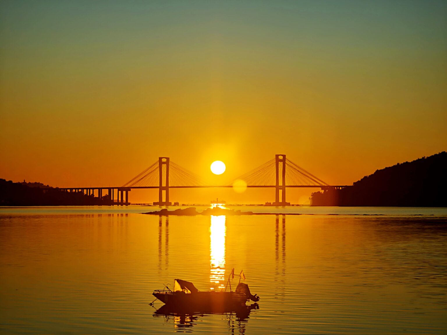 Rande Bridge sunset from Cesantes beach
