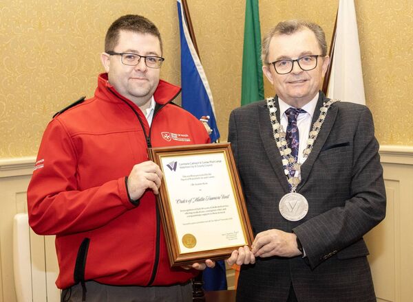 Pictured at City Hall, where Mayor of Waterford City & County Cllr. Seamus Ryan held a reception for Order of Malta Tramore Unit, in recognition of their 80 years dedicated service, ofering medical care, emergency relief and compassionate support to those in need, Derek O'Brien. accepted the scroll on behalf of the Unit Photo: Joe Evans