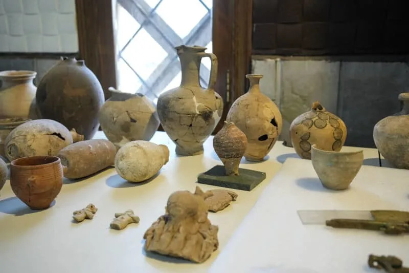 An image shows a display case in the Idlib City Museum featuring some of the 1,234 cuneiform clay tablets (dating to the third millennium BC) and 189 other artifacts that were looted or went missing from the museum during the Syrian war in 2015. Moawia Atrash/dpa